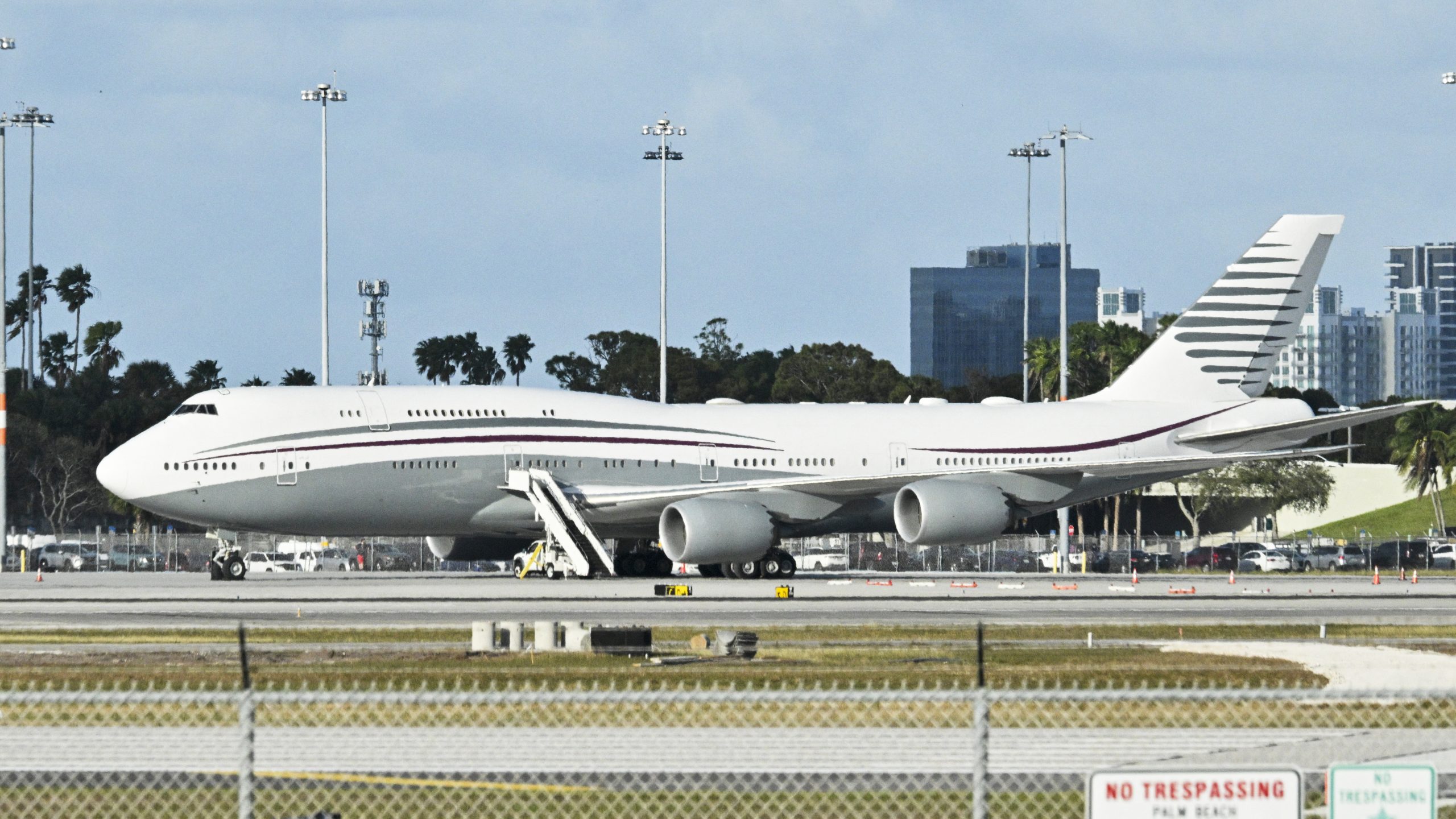 In this February 15, 2025 a Qatari Boeing 747 sits on the tarmac of Palm Beach International airport after US President Donald Trump toured the aircraft on February 15, 2025. Donald Trump plans to accept a luxury Boeing jet from the Qatari royal family for use as Air Force One and then continue flying in it after his tenure, despite strict rules on US presidential gifts, media reported May 11, 2025. Calling the plane a "flying palace," ABC News, which first reported the story, said the Boeing 747-8 jumbo jet would possibly be the most expensive gift ever received by the American government. (Photo by ROBERTO SCHMIDT / AFP) (Photo by ROBERTO SCHMIDT/AFP via Getty Images)