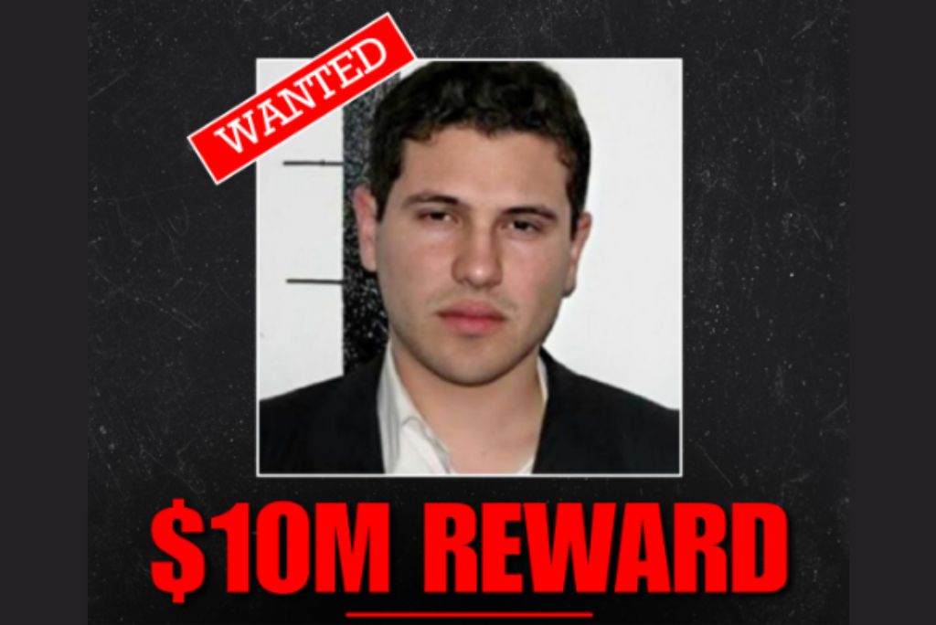 Wanted poster featuring a man with a serious expression, offering a $10 million reward for information leading to his capture.