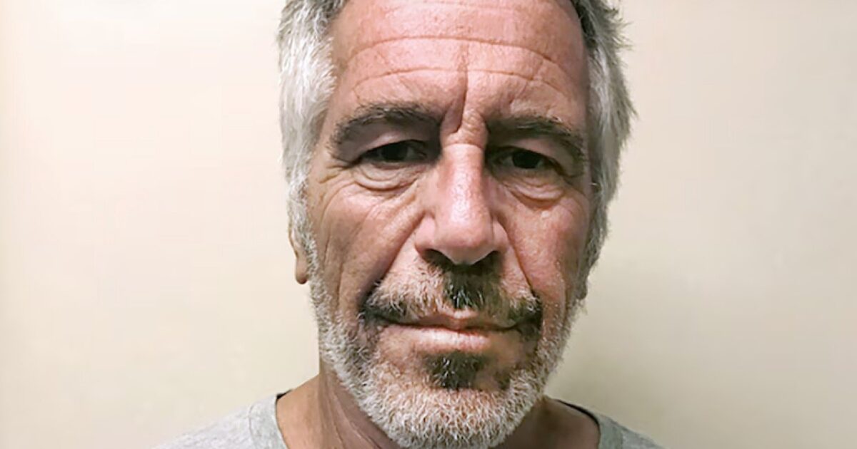 Mugshot of a middle-aged man with gray hair and a beard, looking directly at the camera against a neutral background.