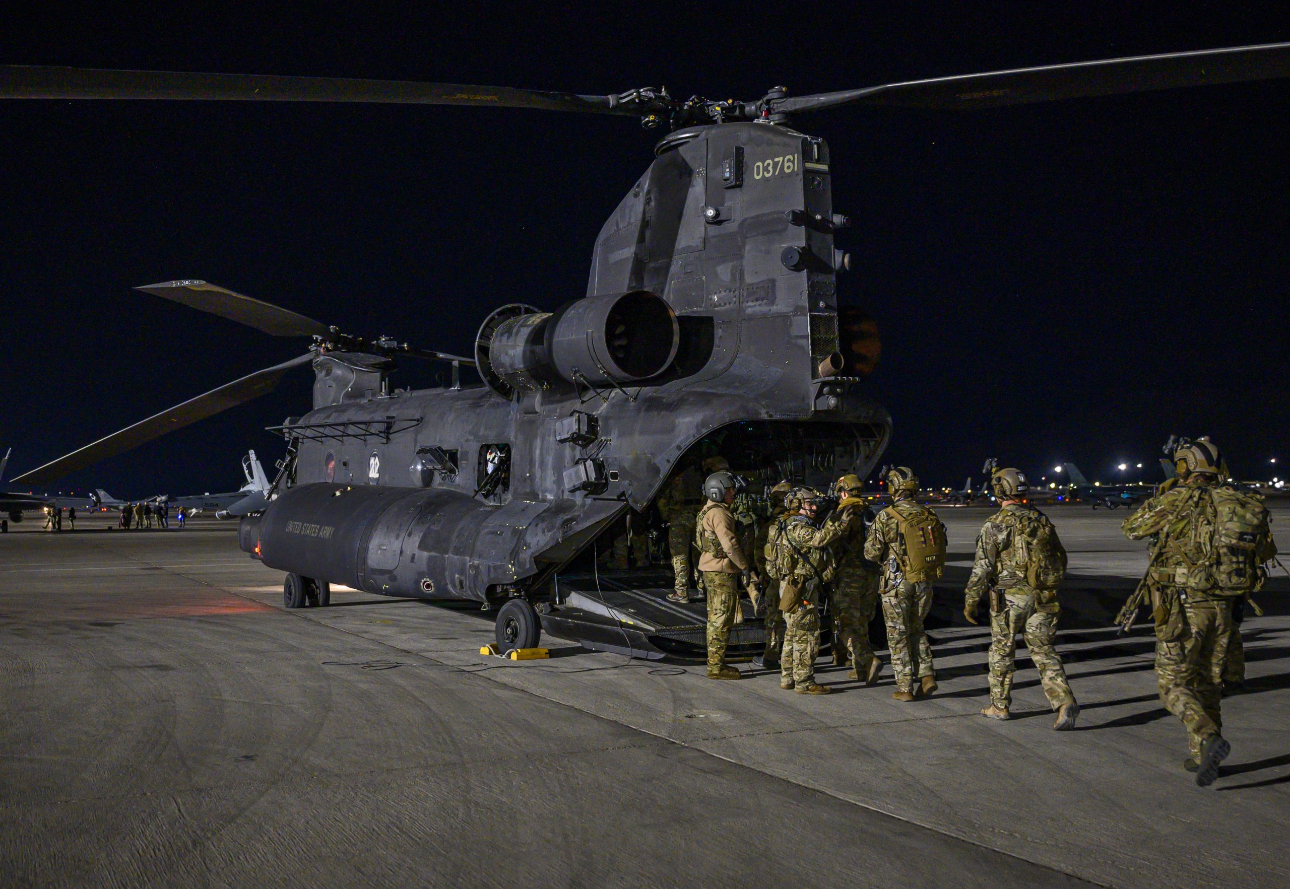 U.S. Army Soldiers enter an MH-47G Chinook helicopter assigned to the 3rd Battalion, 160th Special Operations Aviation Regiment at Hunter Army Airfield, Georgia, before it takes-off during Weapons School Integration (WSINT) at Nellis Air Force Base, Nevada, Dec. 2, 2020. U.S. Army units came together during WSINT to support the exercise by simulating scenarios of current and future threats. (U.S. Air Force photo by Airman 1st Class Dwane R. Young)