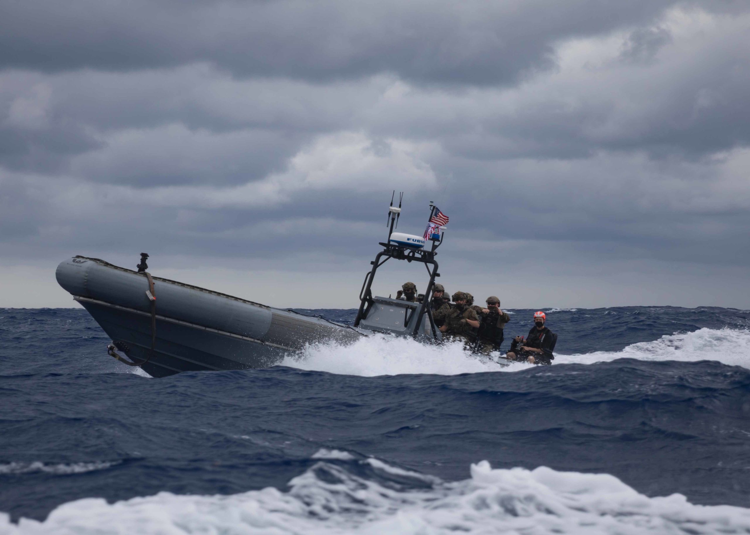 210401-N-RL695-1205 ATLANTIC OCEAN (April 1, 2021) Coastguardsmen assigned to Tactical Law Enforcement Team 109, Cape Cod Maritime Safety Security Team (MSST), and Sailors assigned to the Freedom-variant littoral combat ship USS Sioux City (LCS 11), participate in a non-compliant vessel pursuit tactics exercise in a rigid-hull inflatable boat (RHIB), April 1, 2021. Sioux City is operating in the U.S. 2nd Fleet in support of naval operations to maintain stability and security in the Atlantic and Arctic in order to ensure access, deter aggression and defend U.S., allied and partner interests. (U.S. Navy photo by Mass Communication Specialist 2nd Class Marianne Guemo/Released)