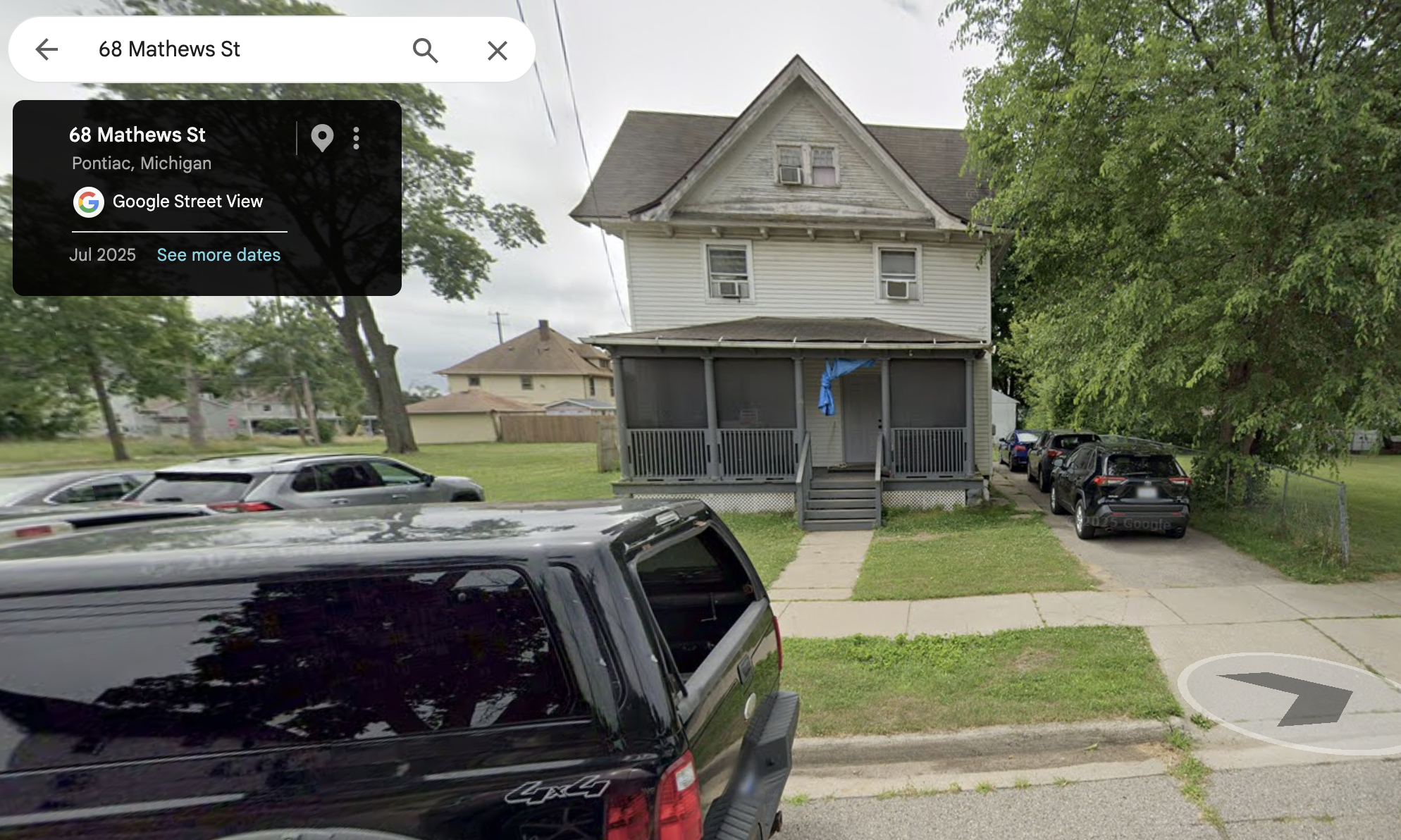 Exterior view of a multi-story house at 68 Mathews St, Pontiac, Michigan, with parked cars and a grassy area in the foreground.