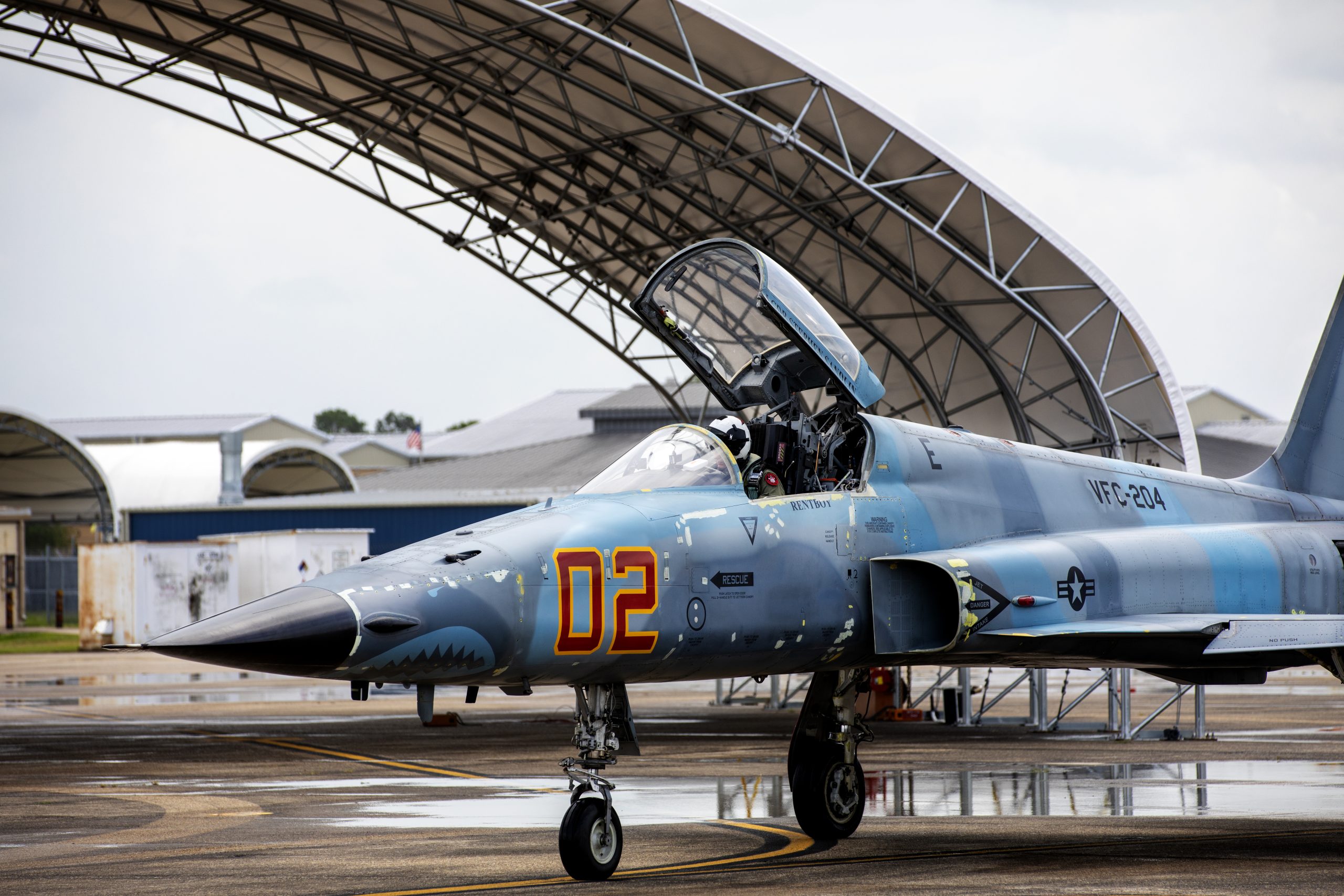 230712-N-HT995-2611 NEW ORLEANS, LA. (July 13, 2023) Cmdr. Andrew Anderson, assigned to The "River Rattlers" of Fighter Squadron Composite (VFC) 204, taxis the F-5N Tiger II on Naval Air Station Joint Reserve Base New Orleans, La., July 13, 2023. VFC-204 is one of four squadrons assigned to the Navy Reserve's Tactical Support Wing that provide adversary support to the fleet. (U.S. Navy photo by Mass Communication Specialist 2nd Class Omar N. Rubi)