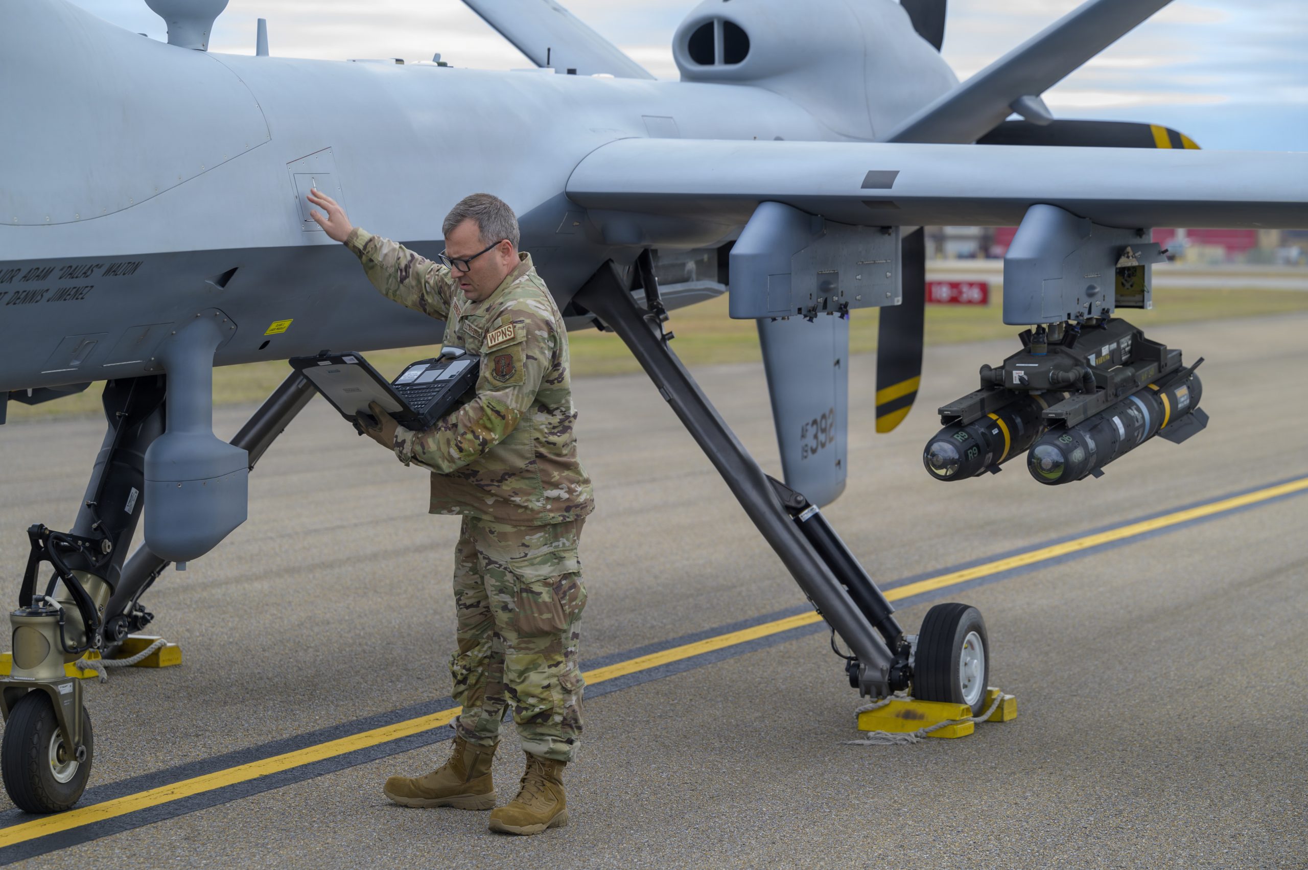 U.S. Air Force Tech. Sgt. Mark Oberacker, an aerospace ground equipment specialist assigned to the 174th Attack Wing, New York Air National Guard, checks data on the MQ-9 Reaper aircraft during exercise Sentry South 26-2 in Gulfport, Mississippi, March 3, 2026. Sentry South 26-2 is a large force employment exercise focused on major combat operations and joint maritime opportunities in a contested or degraded operational environment. Sentry South 26-2 applies joint and combined warfighting doctrine against realistic and robust enemy integrated threat systems, all while under safe and controlled conditions. (U.S. Air National Guard photo by Staff Sgt. Dylan McCrink)