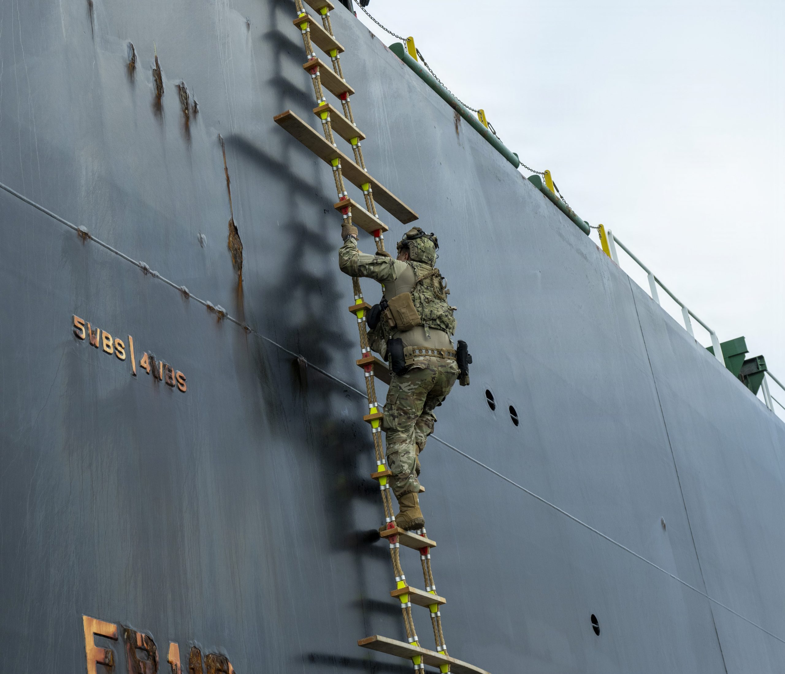 Coast Guard Petty Officer 1st Class Giordano Rodriguez, a maritime enforcement specialist assigned to Coast Guard Port Security Unit 301, climbs a Jacob’s ladder to board an oil tanker vessel for a large vessel security boarding off the coast of San Pedro, California, April 8, 2026. Large vessel security boardings are a critical component of the U.S. Coast Guard's mission to ensure the safety and security of our nation's maritime interests and are essential for protecting our ports and waterways from a variety of threats. (U.S. Coast Guard photo by Petty Officer 3rd Class Roberto A. Nieves Felix)