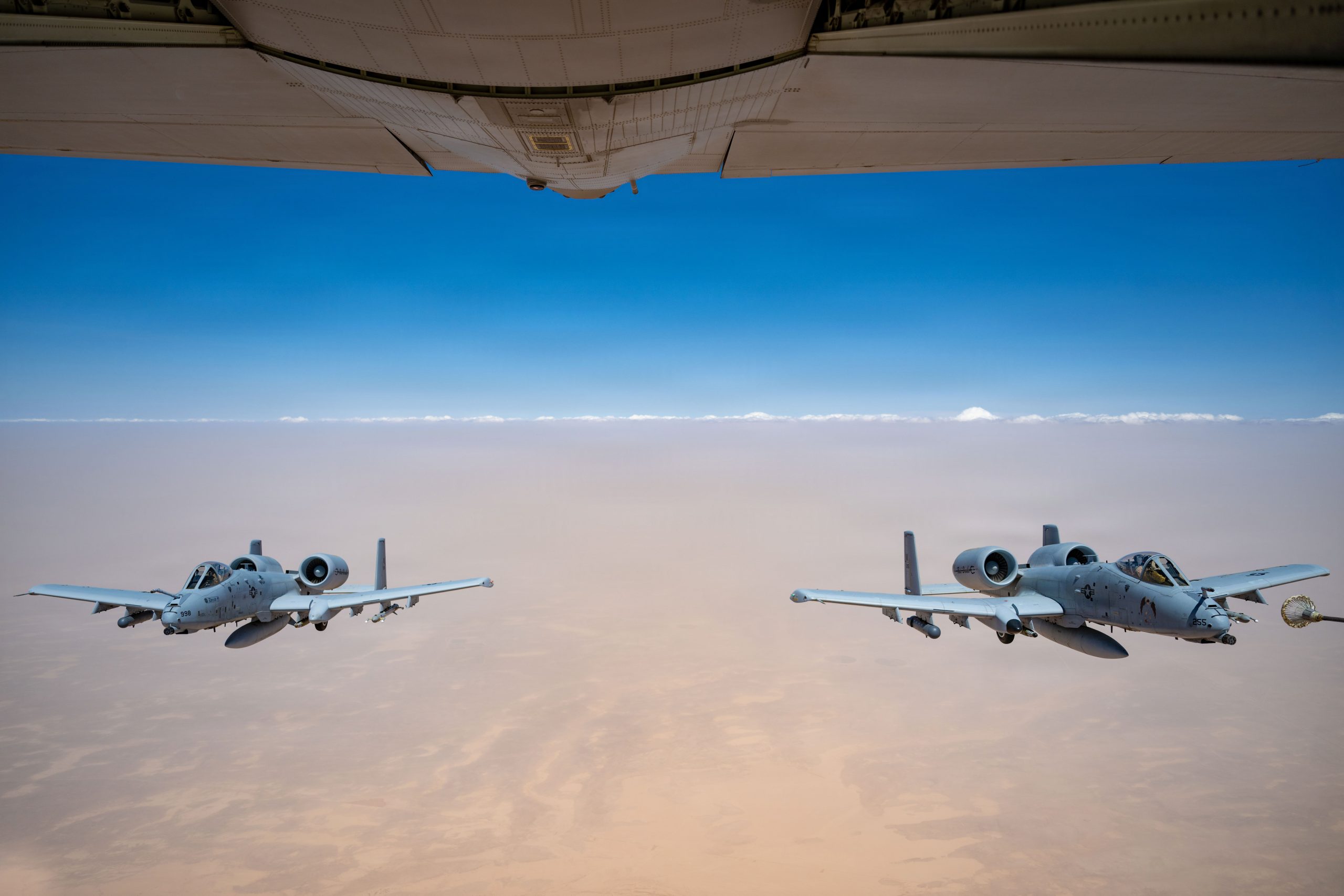 Two U.S. Air Force A-10C Thunderbolt II aircraft approach an HC-130J Combat King II aircraft for aerial refueling in the U.S. Central Command area of responsibility, May 9, 2026. (U.S. Air Force photo)