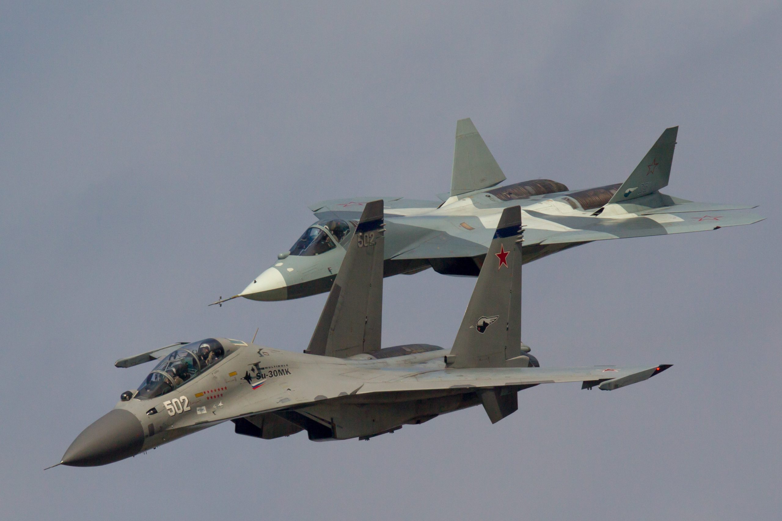 Sukhoi T-50 and Sukhoi Su-30MK jet fighters of Russian Air Force fly in formation at MAKS-2013 International Airshow near Zhukovsky, Russia. (Photo by: aviation-images.com/Universal Images Group via Getty Images)