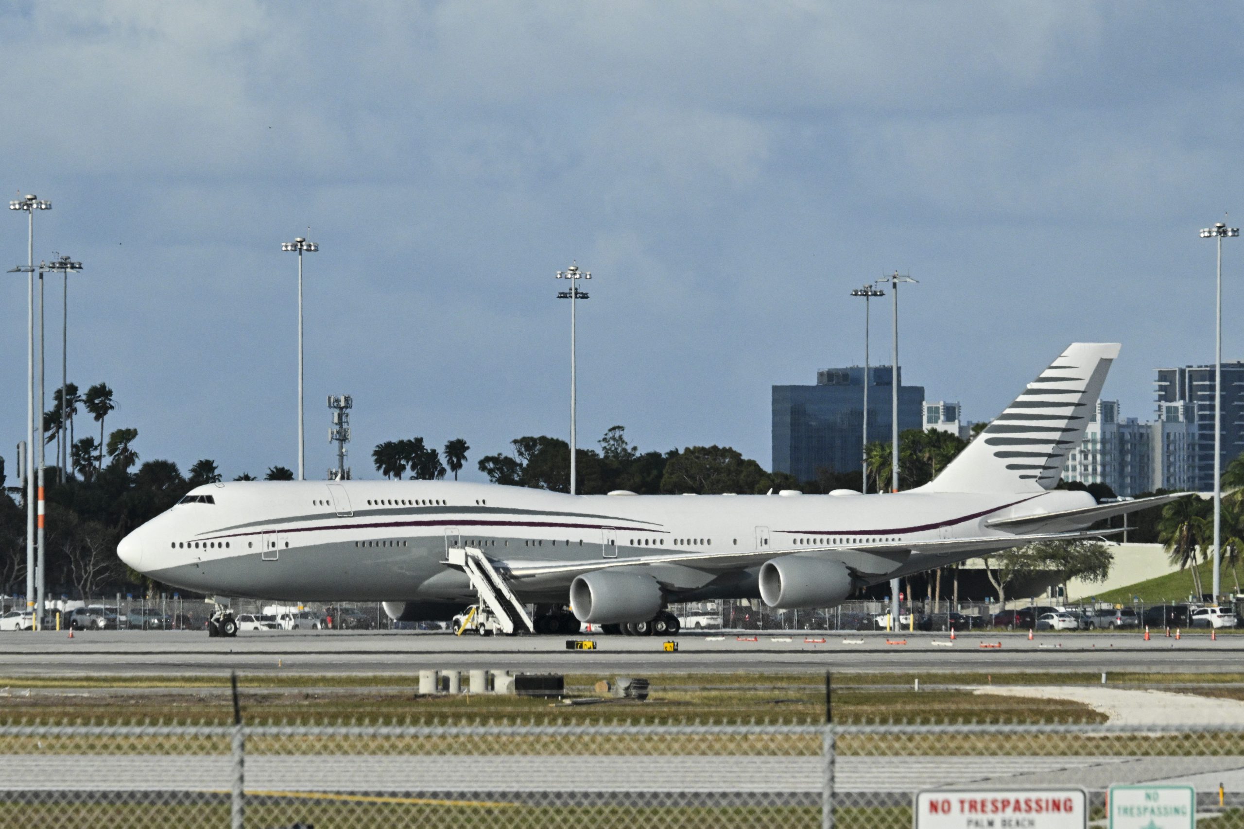 In this February 15, 2025 a Qatari Boeing 747 sits on the tarmac of Palm Beach International airport after US President Donald Trump toured the aircraft on February 15, 2025. Donald Trump plans to accept a luxury Boeing jet from the Qatari royal family for use as Air Force One and then continue flying in it after his tenure, despite strict rules on US presidential gifts, media reported May 11, 2025. Calling the plane a "flying palace," ABC News, which first reported the story, said the Boeing 747-8 jumbo jet would possibly be the most expensive gift ever received by the American government. (Photo by ROBERTO SCHMIDT / AFP) (Photo by ROBERTO SCHMIDT/AFP via Getty Images)