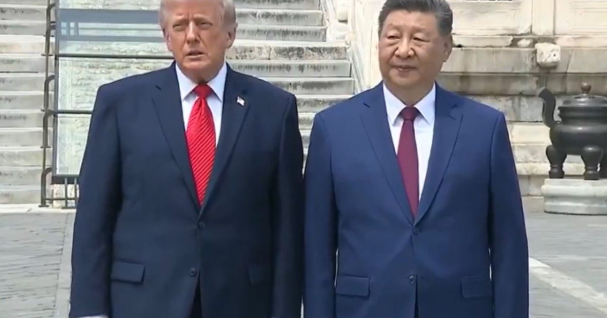Former U.S. President Donald Trump and Chinese President Xi Jinping stand together during a diplomatic meeting, showcasing international relations and leadership.