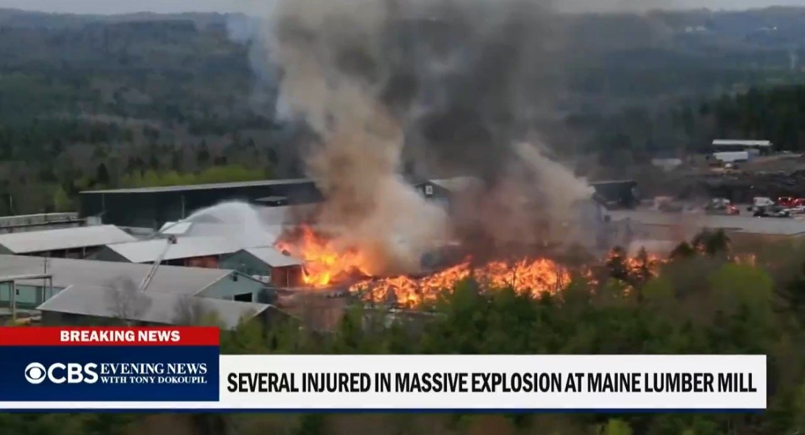 Smoke and flames engulf a lumber mill in Maine following a massive explosion, resulting in several injuries and significant damage.