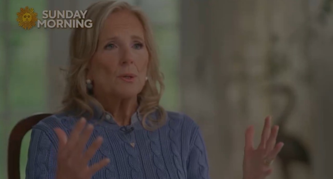 Jill Biden speaking during an interview on CBS Sunday Morning, expressing her thoughts with hand gestures in a cozy setting.