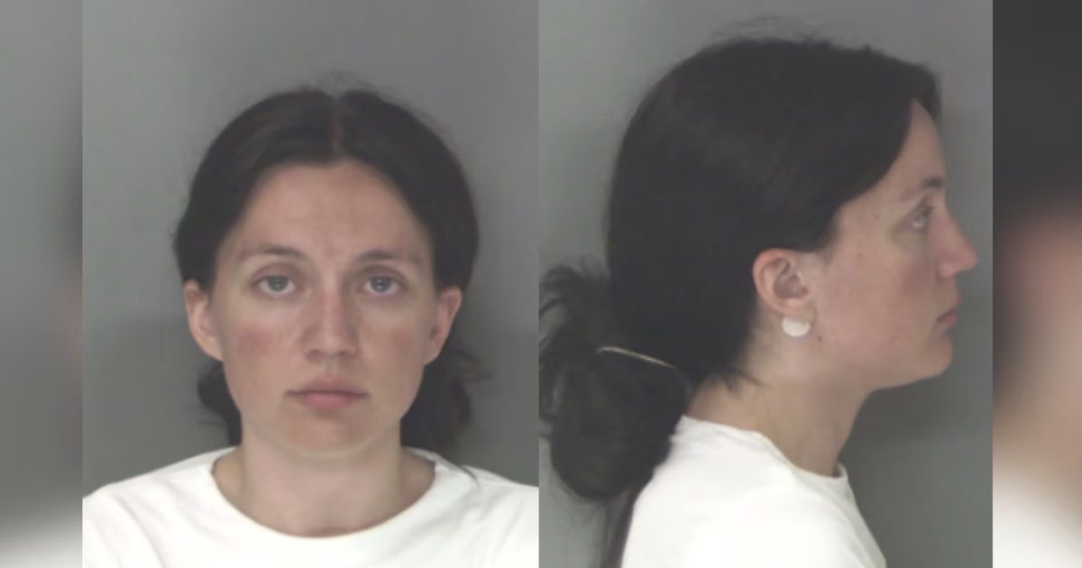 Mugshot of a woman with dark hair, wearing a white shirt, shown from the front and side against a gray background.