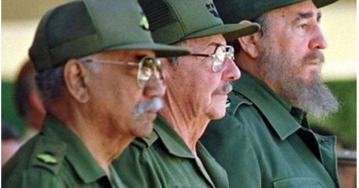 Three military leaders in green uniforms and caps stand side by side, showcasing their serious expressions during a formal event.