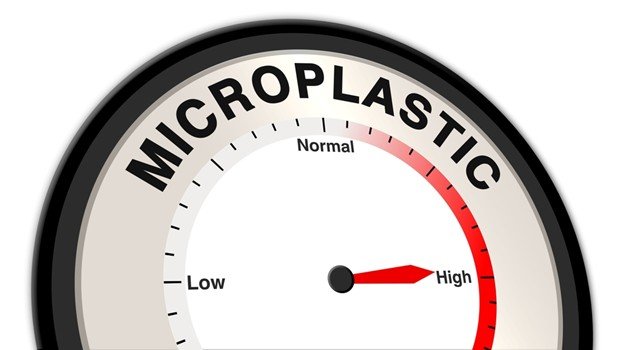 Microplastic gauge indicating levels from low to high, highlighting environmental concerns related to microplastic pollution.