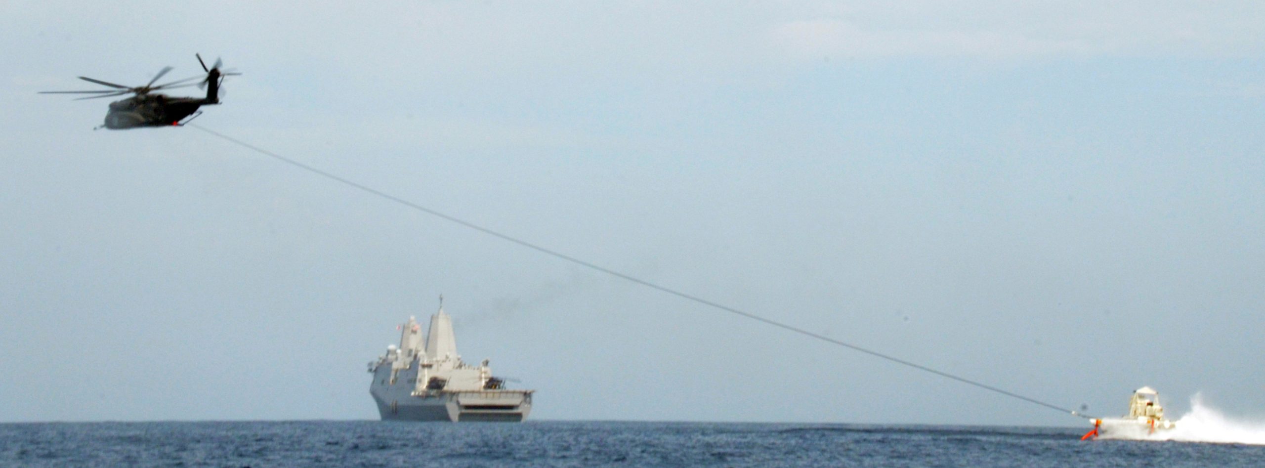 An MH-53 Sea Dragon, Helicopter Mine Countermeasures Squadron 14 attached to USS Anchorage (LPD 23), controls an Mk-105 magnetic mine sweeping sled during Rim of the Pacific (RIMPAC) exercise 2014. Twenty-two nations, 49 ships, six submarines, more than 200 aircraft and 25,000 personnel are participating in RIMPAC exercise from June 26 to Aug. 1 in and around the Hawaiian Islands and Southern California. The world's largest international maritime exercise, RIMPAC provides a unique training opportunity that helps participants foster and sustain the cooperative relationships that are critical to ensuring the safety of sea lanes and security on the world's oceans. RIMPAC 2014 is the 24th exercise in the series that began in 1971.(U.S. Navy Photo by Ensign Lindsay Lewis/Released)