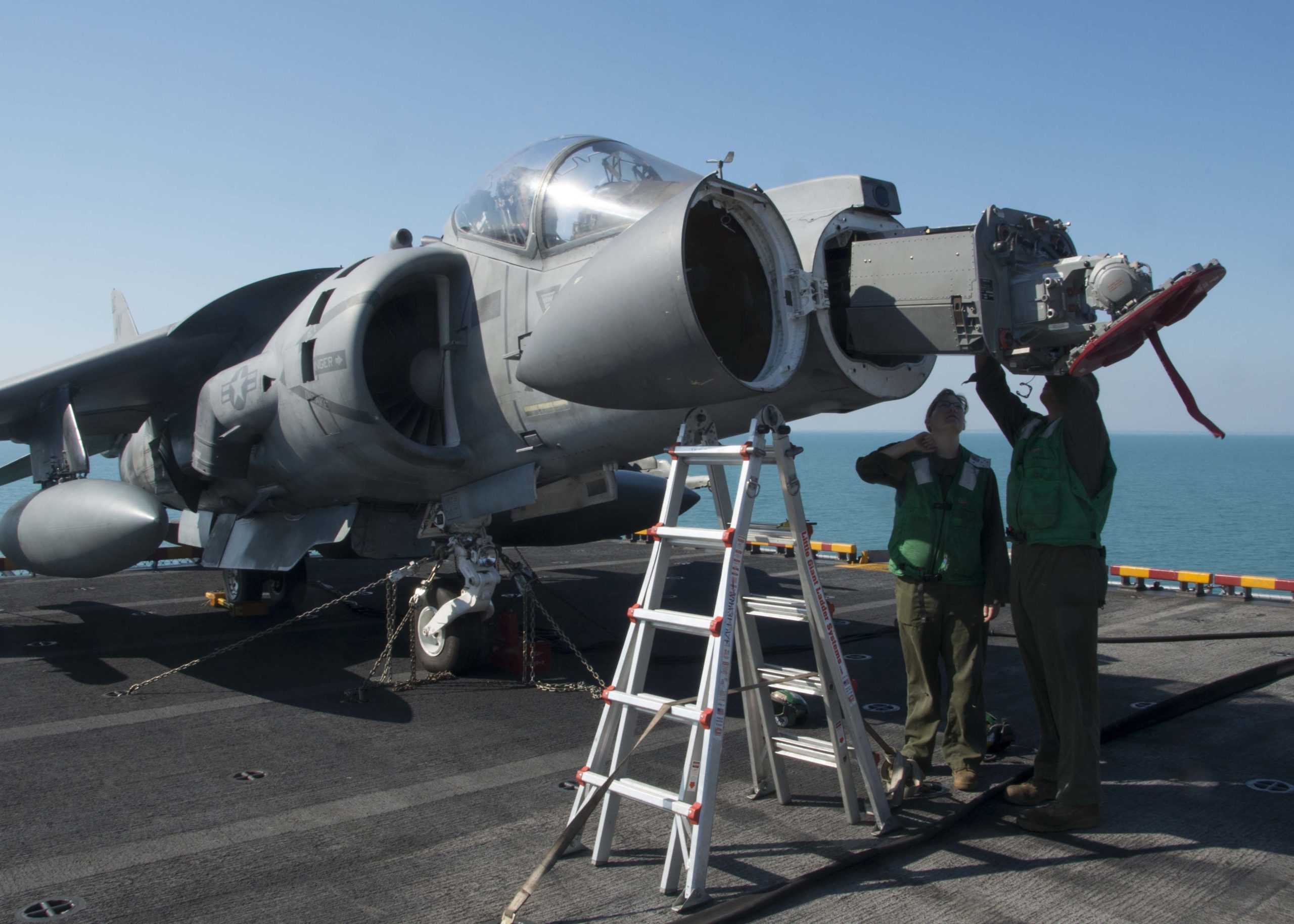 150719-N-NP779-003 INDIAN OCEAN (July 23, 2015) – Marine Sgt. Richard Szmygiel, from Oceanside, N.Y., and Marine Cpl. Erin Smith, from Spokane, Wash., VMA 311 ), work on a RADAR in the nose of an AV8B Harrier on the flight deck onboard forward-deployed amphibious assault ship USS Bonhomme Richard (LHD6). Bonhomme Richard is the lead ship of the Bonhomme Richard Expeditionary Strike Group and is on patrol in the U.S. 7th Fleet area of responsibility. (U.S Navy photo by Mass Communication Specialist 1st Class Ty C. Connors/ Released)