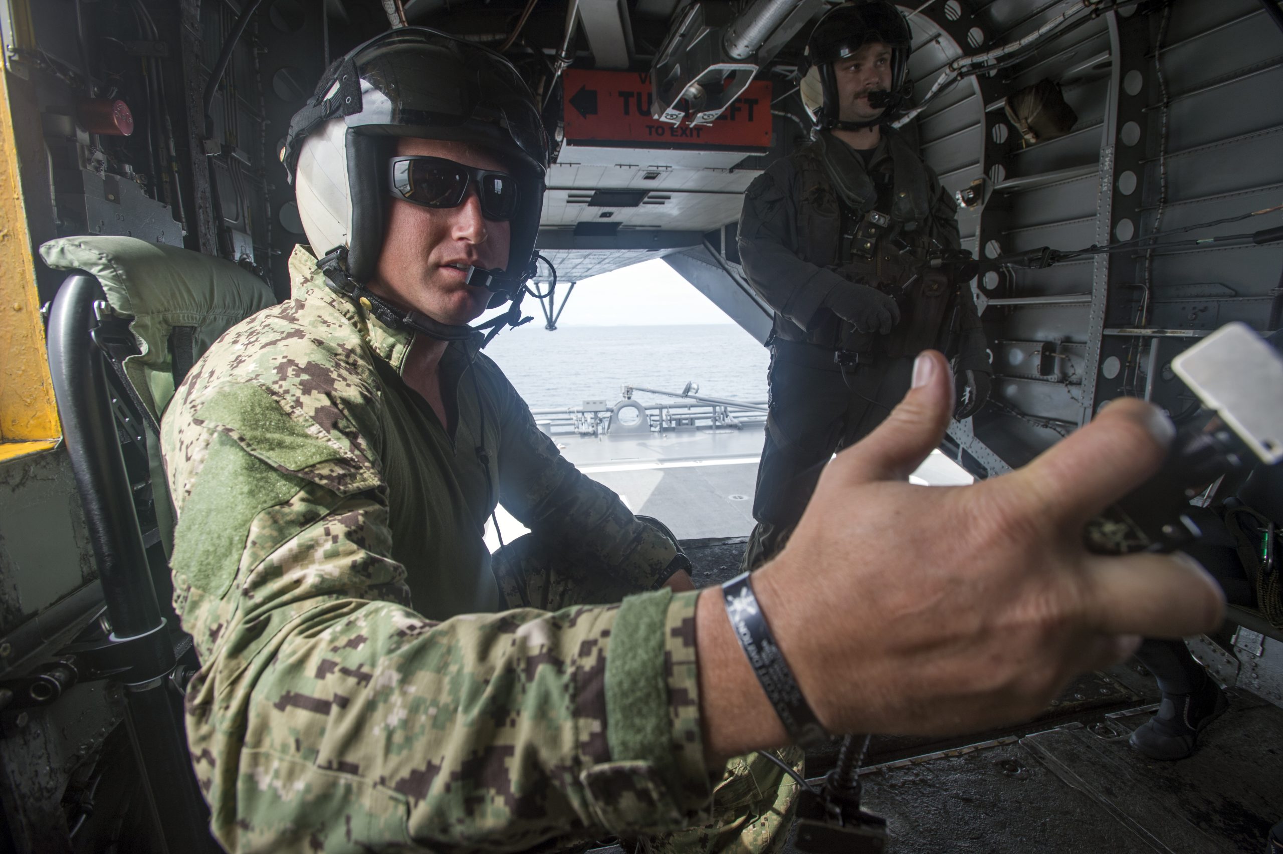 An explosive ordnance disposal technician, assigned to Explosive Ordnance Disposal Mobile Unit 5 Platoon 502, operates a communications system aboard an MH-53 helicopter belonging to Helicopter Mine Countermeasures Squadron (HM) 14 during the 2JA Mine Countermeasure Exercise (2JA MCMEX) in Japan’s Mutsu Bay July 24, 2017. 2JA MCMEX is an annual bilateral exercise between the U.S. Navy and Japan Maritime Self-Defense Force to strengthen interoperability and increase proficiencies in mine countermeasure operations. (U.S. Navy Combat Camera photo by Mass Communication Specialist 2nd Class Alfred A. Coffield)