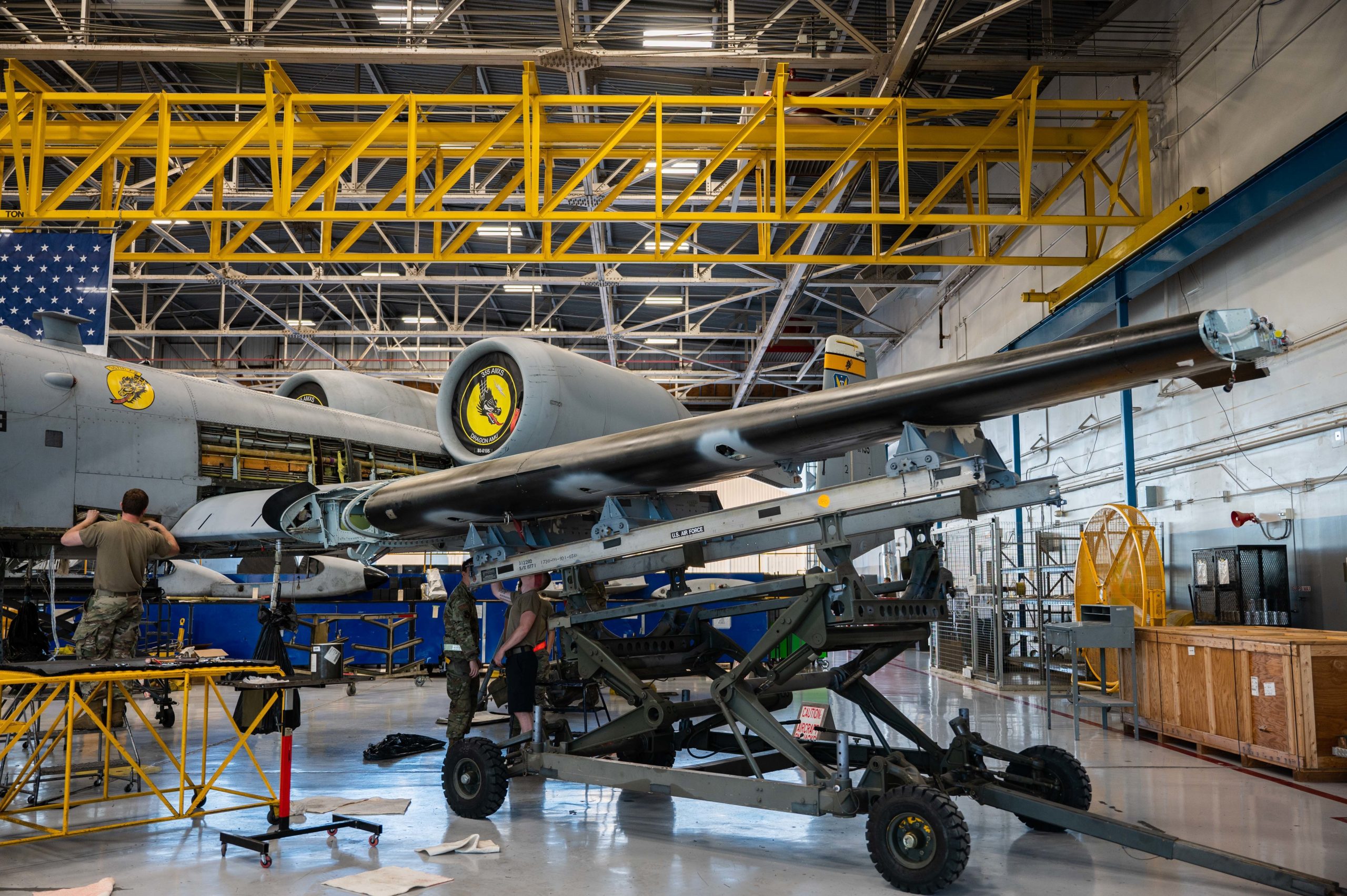 U.S. Air Force Airmen assigned to the 309th Aircraft Maintenance Group Expeditionary Depot Maintenance team replace the wings on an A-10 Thunderbolt II assigned to the 357th Fighter Generation Squadron at Davis-Monthan Air Force Base, Arizona, Oct. 11, 2022. Due to the extensive in-depth work required to complete a wing swap, skilled professionals from the 309th AMXG Expeditionary Depot forward deployed to DM for this major component maintenance. (U.S. Air Force photo by Senior Airman Kaitlyn Ergish)