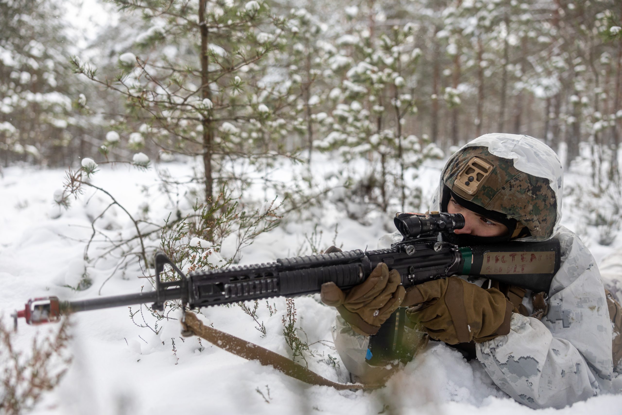 U.S. Marine Corps Lance Cpl. Thomas Teague, a motor vehicle operator assigned to Combat Logistics Battalion 6, Combat Logistics Regiment 2, 2nd Marine Logistics Group, provides security for a convoy during offensive and defensive operations in Syndalen, Finland during exercise Freezing Winds 23 (FW23), Nov. 30, 2023. FW23 is a Finnish-led maritime exercise in which United States Marines assigned to Marine Rotational Force- Europe, and U.S. Navy Forces Europe take part; the exercise serves as a venue to increase Finnish Navy readiness, increase U.S., Finland, and NATO partners' interoperability in operational logistics, integrated fires, and amphibious operations within the Baltic Sea littorals. (U.S. Marine Corps photo by Lance Cpl. Christian Salazar)