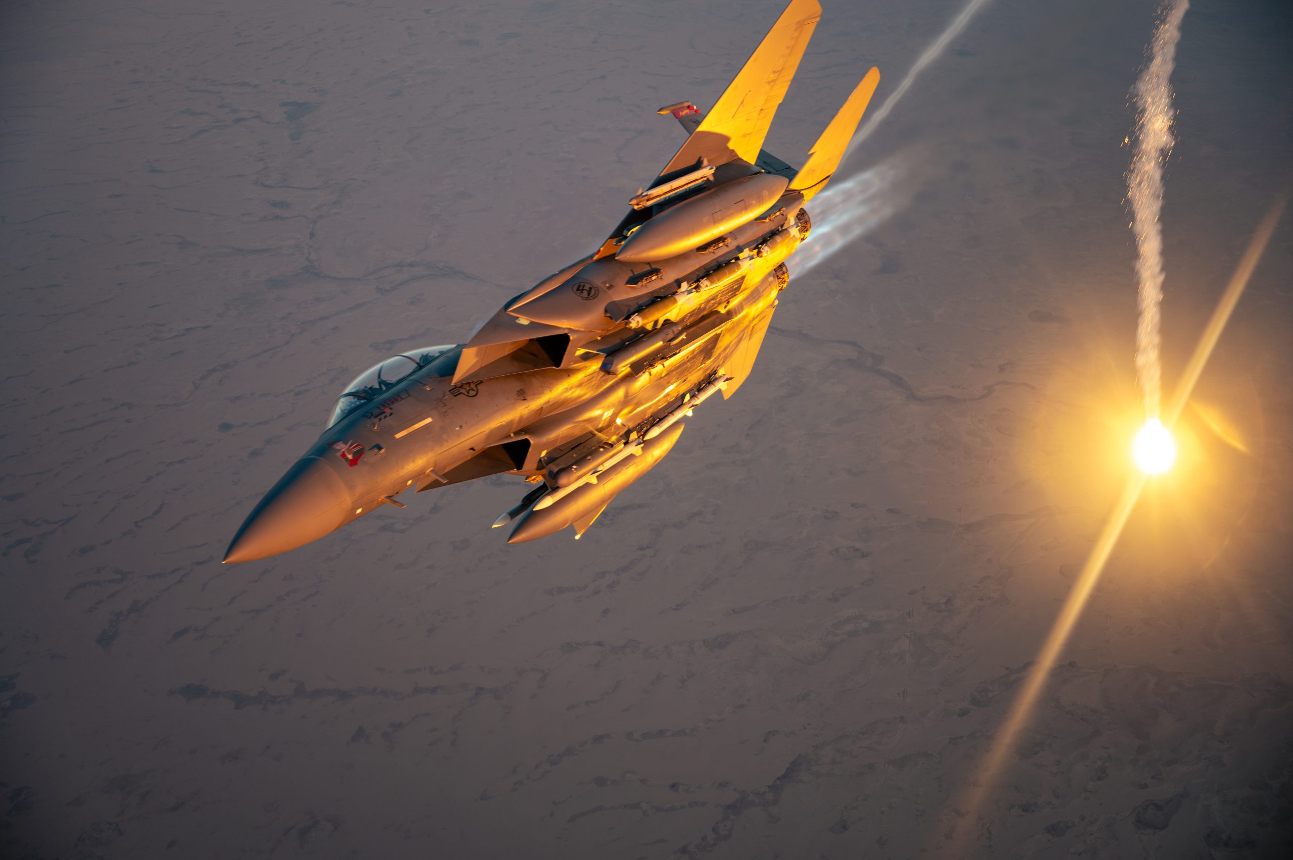 A U.S. Air Force F-15E Strike Eagle performs a flare check over the U.S. Central Command area of responsibility, March 9, 2025. The F-15E is deployed within the CENTCOM AOR to help defend U.S. interests, promote regional security, and deter aggression in the region. (U.S. Air Force photo by Senior Airman Zachary Willis)