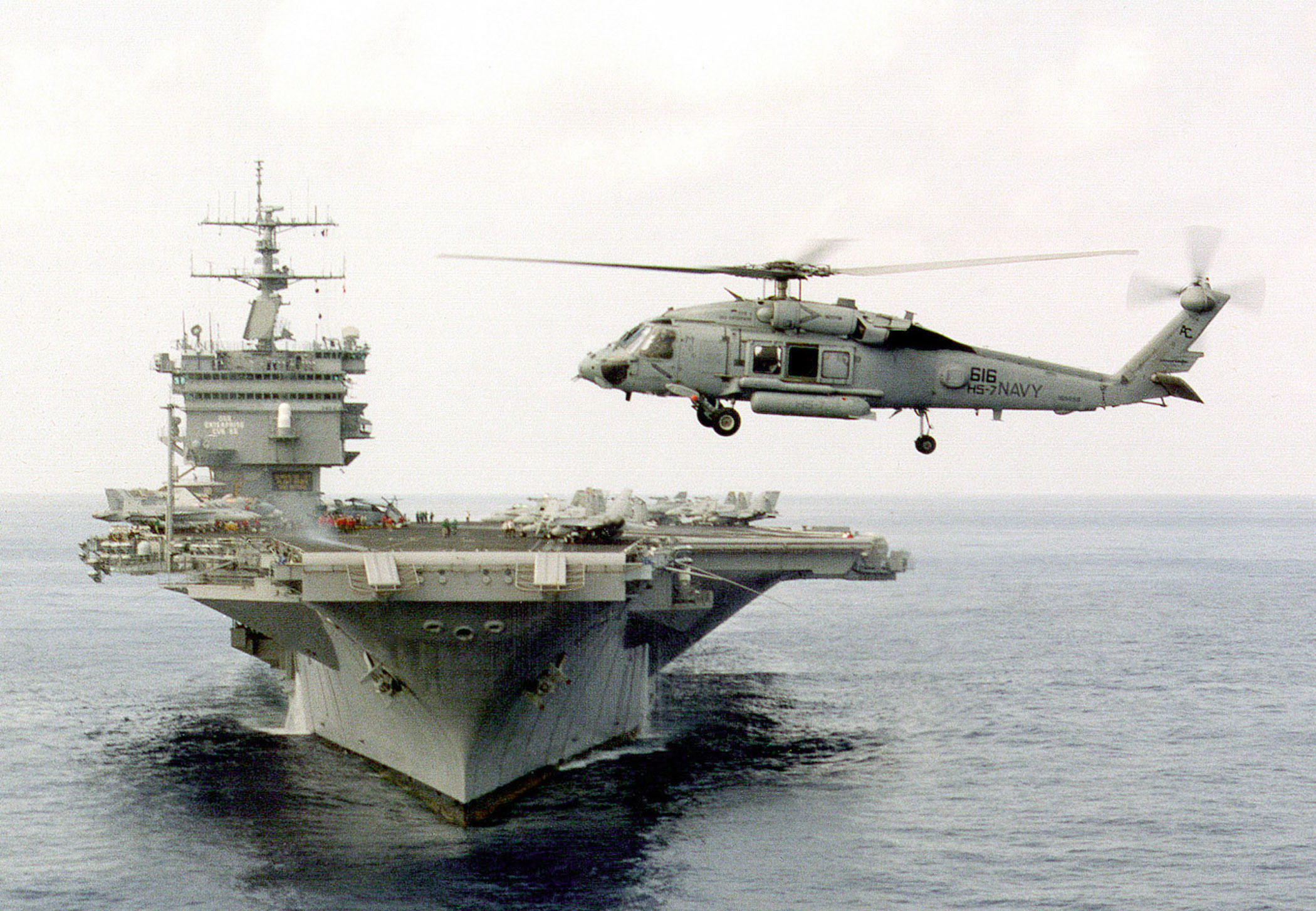 An SH-60 Blackhawk helicopter assigned to Helicopter Anti-Submarine Squadron Seven (HS-7) hovers off the bow of the aircraft carrier USS Enterprise CVN 65. The Enterprise and HS-7 are engaged in Composite Training Unit Exercise (COMPTUEX) in the Puerto Rico operating area. (DoD photo by Petty Officer 3rd Class Timothy Smith. (Released))