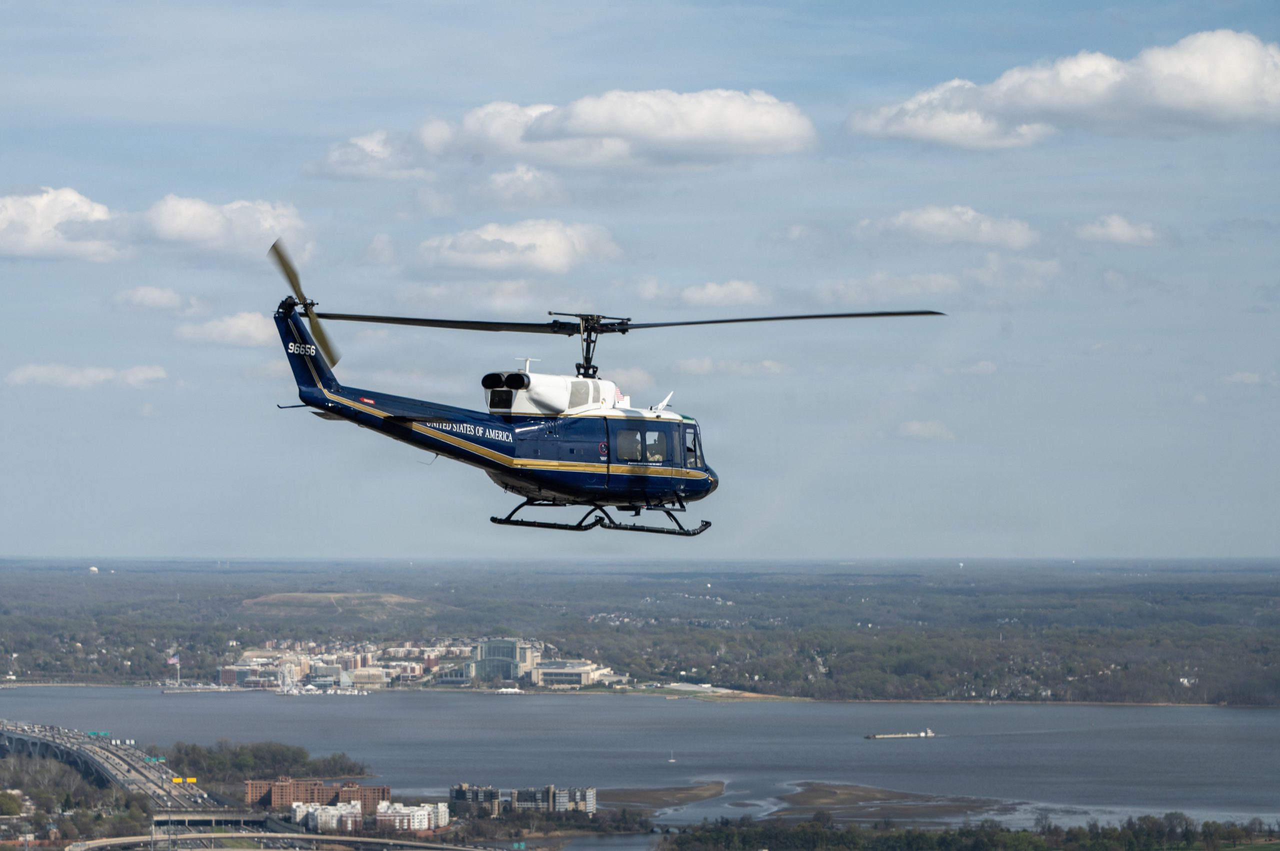 A UH-1N Huey assigned to the 1st Helicopter Squadron at Joint Base Andrews, Maryland, flies over Washington, D.C., during training, March 31, 2026. The 1st HS conducts rotary-wing airlift, security, and contingency operations supporting the National Capital Region. (U.S. Air Force photo by Staff Sgt. Aubree Owens)