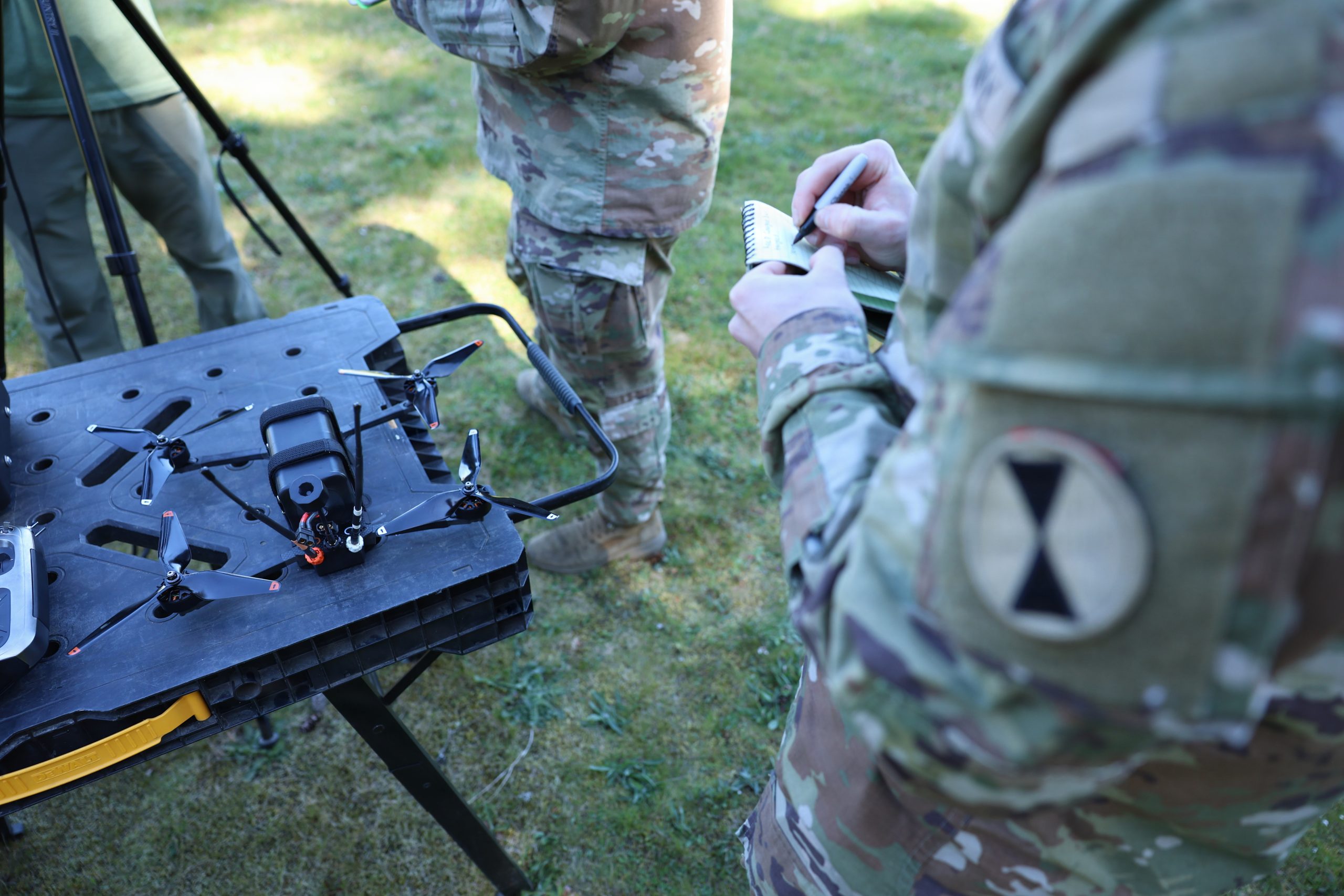 A soldier assigned to 7th Infantry Division takes notes about the Archer Block 1, hotel variant, one way attack 8-inch FPV drone at Joint Base Lewis-McChord, Wash., April 9, 2026. (U.S. Army photo by Staff Sgt. Brandon Rickert)