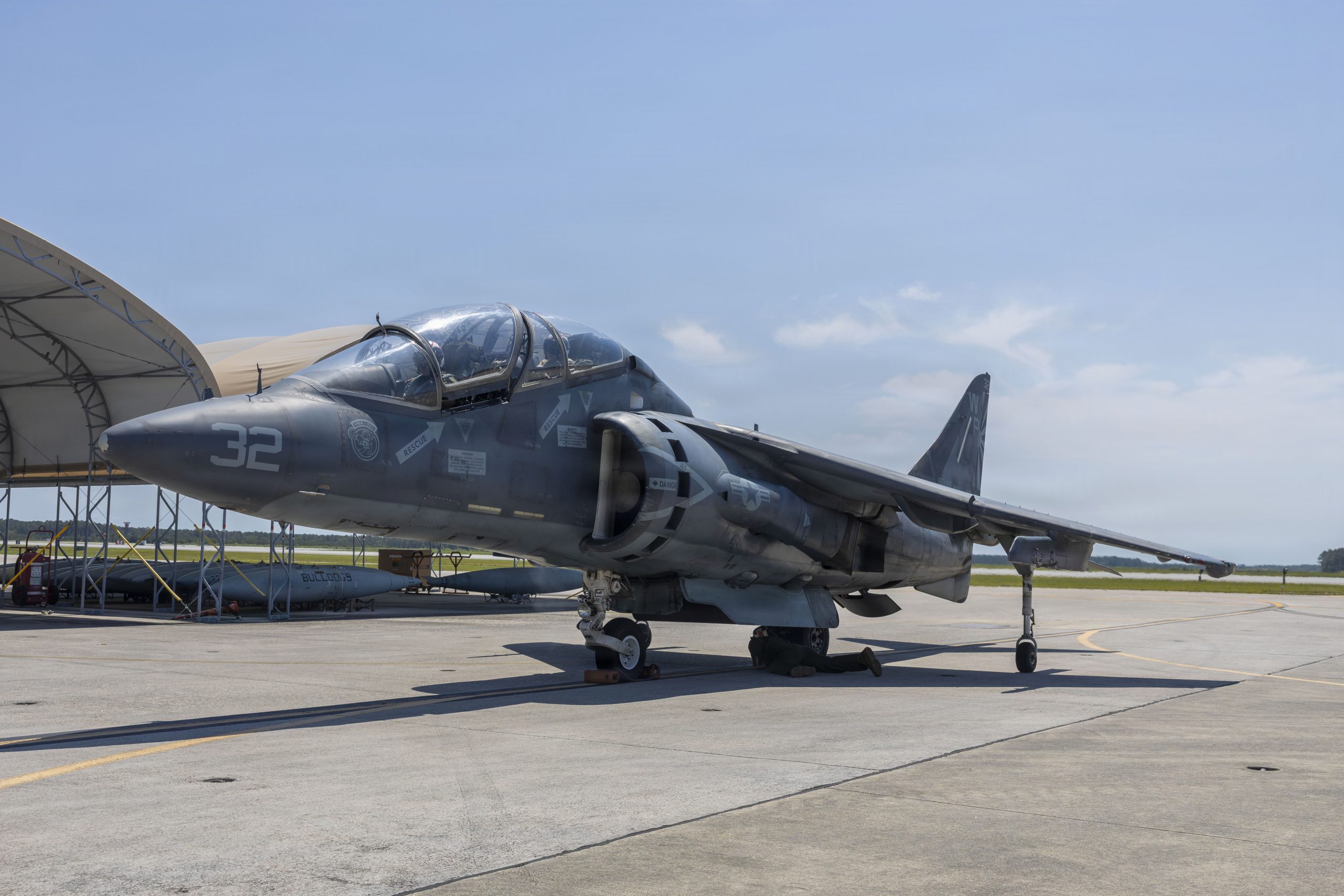 U.S. Marine Corps Maj. Eric Shiebe, left, from Georgia, an AV-8B Harrier pilot and executive officer, and Sgt. Tatiana Rios, right, from Wisconsin, a fixed wing aircraft airframe mechanic, both with Marine Attack Squadron (VMA) 223, Marine Aircraft Group 14, 2nd Marine Aircraft Wing, participate in an incentive flight at Marine Corps Air Station Cherry Point, North Carolina, May 19, 2026. Incentive flights provide an opportunity for Marines within the squadron to ride in the back of a TAV-8B Harrier II as a reward for exceptional job performance. (U.S. Marine Corps photo by Lance Cpl. Bryan Giraldo)