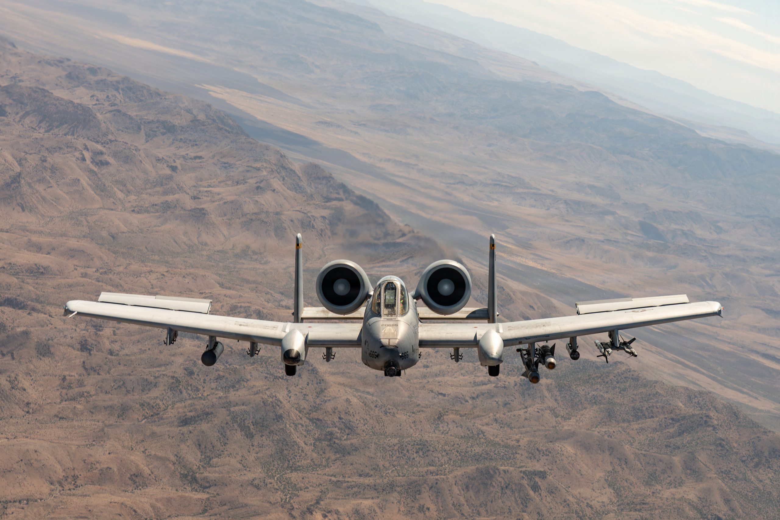 A U.S. Air Force A-10 Thunderbolt II aircraft assigned to the 66th Weapons Squadron, U.S. Air Force Weapons School, flies during a Weapons School Integration mission over the Nevada Test and Training Range, Nevada, May 28, 2026. The mission challenged Weapons School students to sharpen their mastery of weapons employment and tactics integration across combat and mobility forces. (U.S. Air Force photo by Airman 1st Class Jennifer Nesbitt)