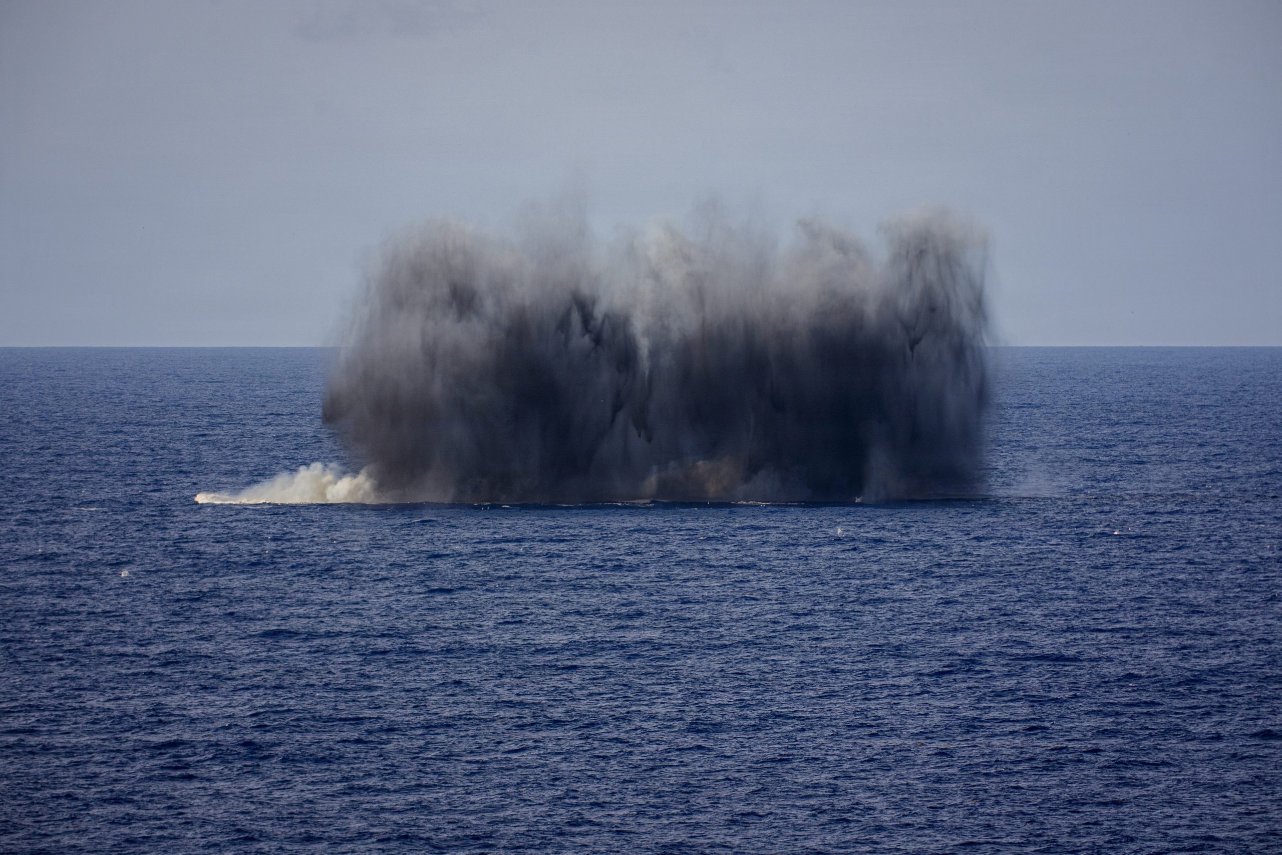 A MK12/BLU-111 aircraft bomb hits a simulated target during an air power demonstration over the Gulf of America, June 11, 2026. U.S. military forces are deployed to the U.S. Southern Command area of responsibility in support of Department of War-directed operations, and the president's priorities to disrupt illicit drug trafficking, deter malign actors and protect the homeland through continuous presence. Nimitz-class aircraft carriers are the pinnacle of mobile naval air power projection and forward operational presence. No other weapons system possesses the responsiveness, endurance, multi-dimensional might, inherent battlespace awareness, and command and control capabilities of a carrier strike group and its embarked air wing. (U.S. Navy photo / Released)