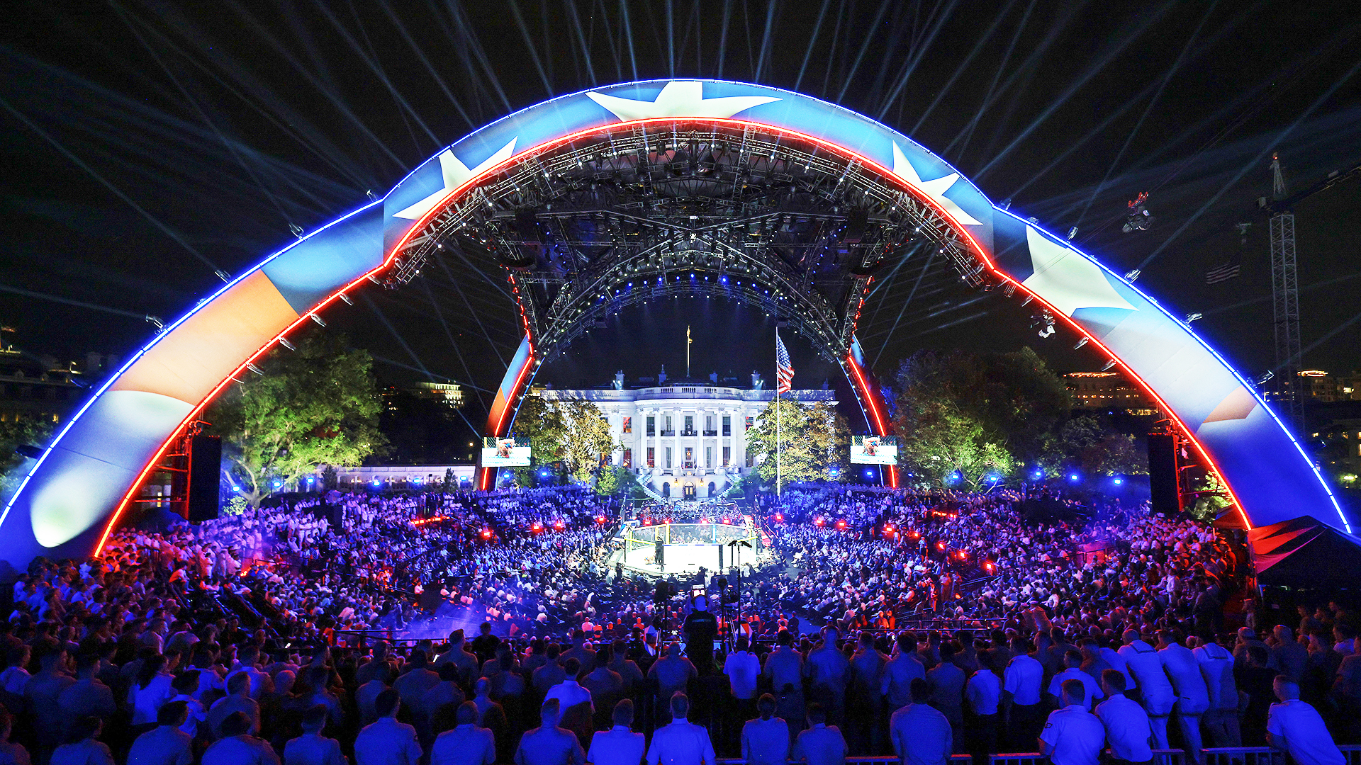 WASHINGTON, DC - JUNE 14: Guests, including members of the U.S. military, attend the Ultimate Fighting Championship (UFC) Freedom 250 mixed martial arts event under the open-air "Claw" on the South Lawn of the White House on June 14, 2026 in Washington, DC. On his 80th birthday, President Donald Trump hosted a series of seven mixed martial arts fights on the South Lawn, which the White House is calling "a once-in-a-generation celebration of the American fighting spirit." (Photo by Chip Somodevilla/Getty Images)