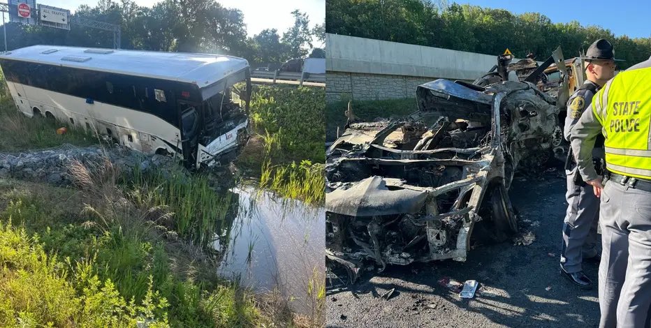 Bus accident scene showing a damaged bus in a ditch and a burnt-out vehicle with state police investigating the area.