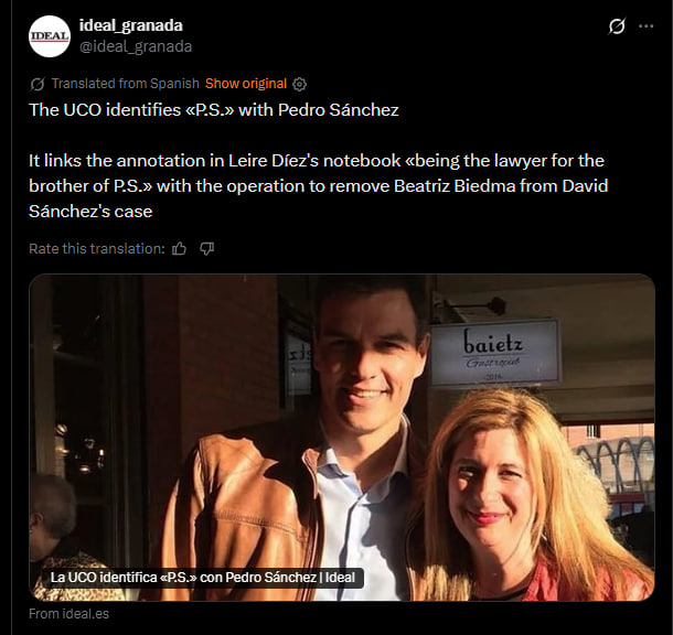 Pedro Sánchez poses for a photo with a woman outside a business, highlighting a connection to a legal case involving Beatriz Biedma and David Sánchez.